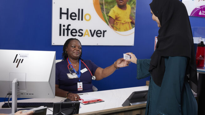 Blood donor registering to make blood donation at NYBC donation center