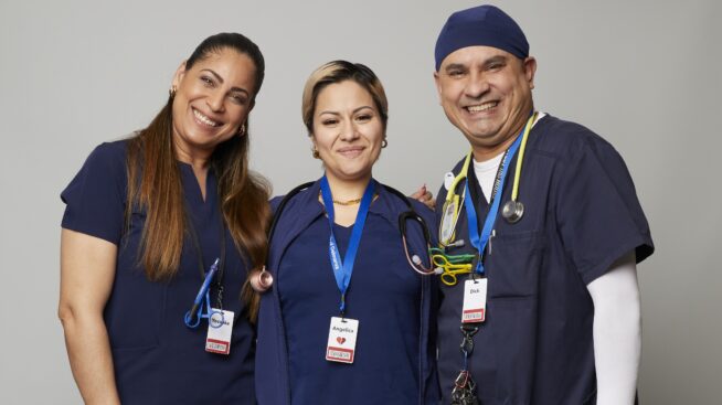 Three smiling NYBC staff at a blood drive.