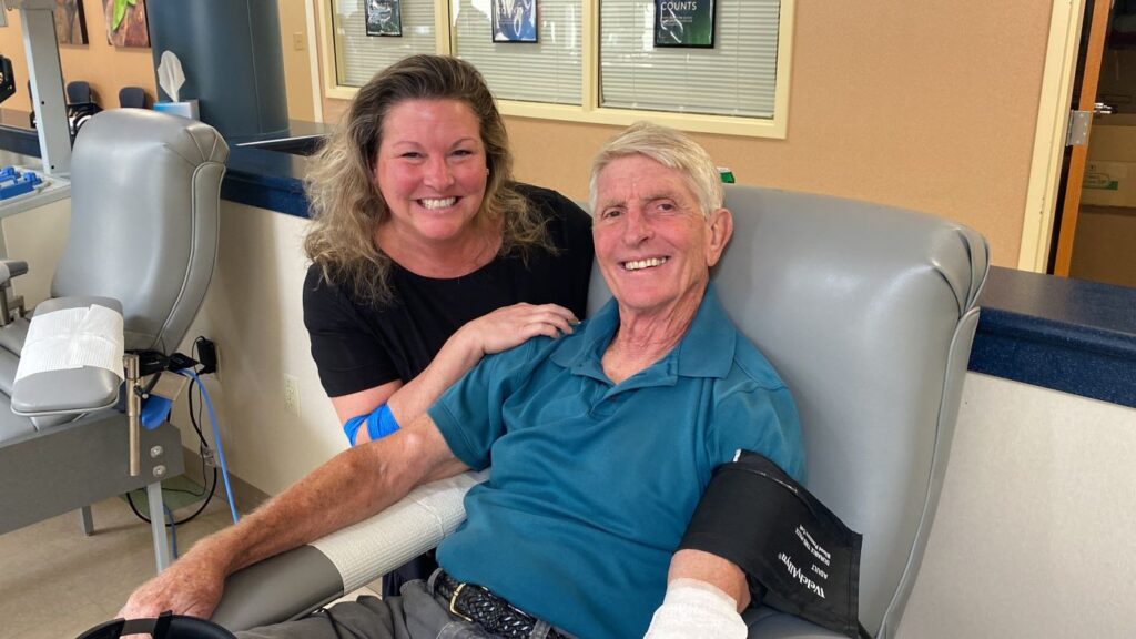 Eric “Pepper” Mayer and his niece Emily Lyons, celebrate his 500th donation as he gives blood.